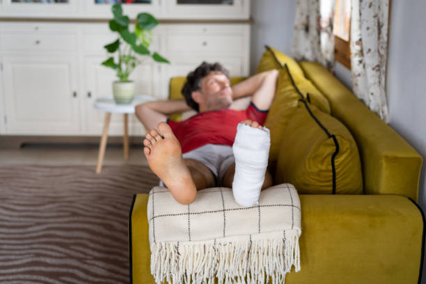 istock Man is relaxing at home, having a broken leg 1419832213