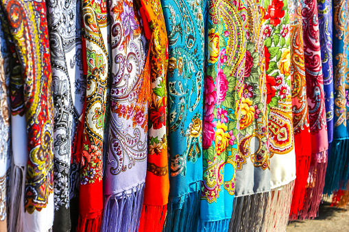 Saint-Petersburg, Russia. Beautiful Russian scarves with floral print at street gift store.