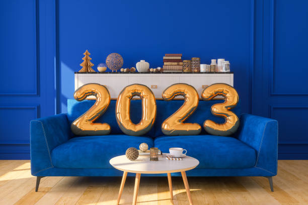 couleur or 2023 ballons de l’année sur canapé bleu - new year wall decoration gift photos et images de collection