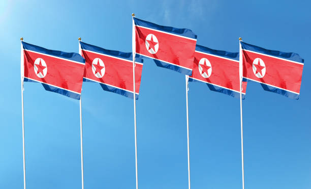 istock North Korea flag on cloudy sky. waving in the sky 1419841554
