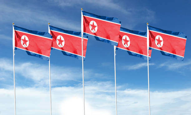 istock North Korea flag on cloudy sky. waving in the sky 1419843105