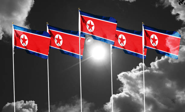 istock North Korea flag on cloudy sky. waving in the sky 1419843464