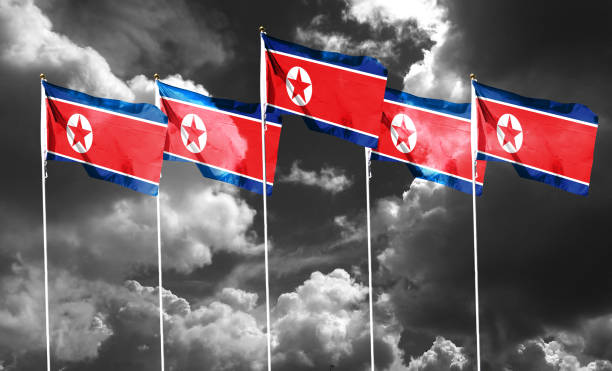 istock North Korea flag on cloudy sky. waving in the sky 1419843851