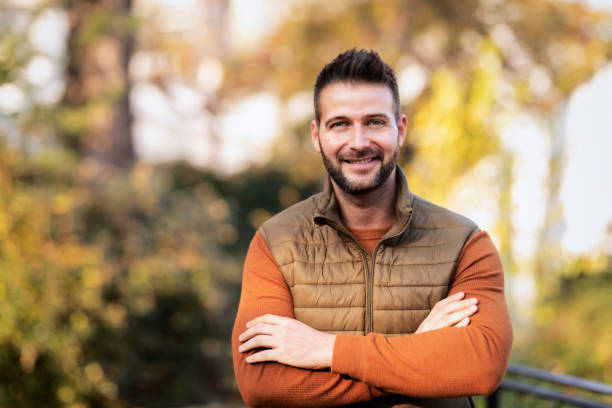 istock Smiling man standing outside in autumn weather 1419849935