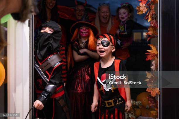 Trick Or Treating With Adults Stock Photo - Download Image Now - 2-3 Years, 25-29 Years, 4-5 Years