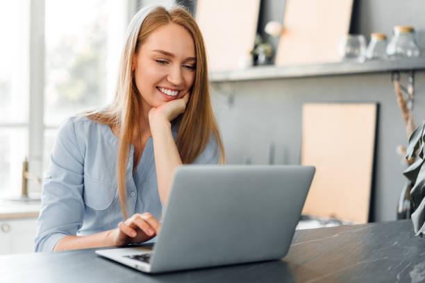 istock Young female entrepreneur working on a laptop at home 1419853250