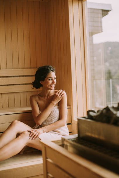 istock Young woman relaxing in the sauna 1419855042