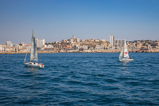 Sailboats cruising on the Mediterranean sea off Marseille, France
