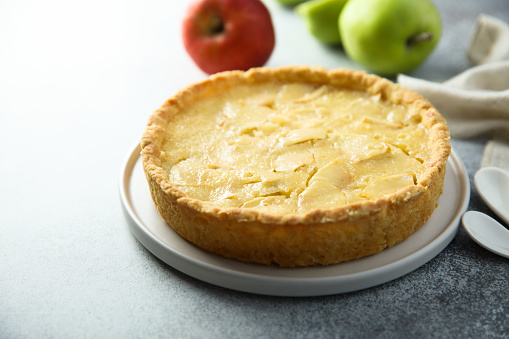 Traditional homemade apple pie with vanilla cream