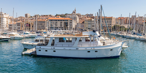 White yatch docked to the pontoons of the Old Port of Marseille in Provence, France