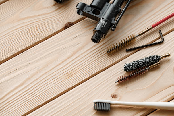 istock Gunsmith's working table for gun cleaning and maintaining 1419857436