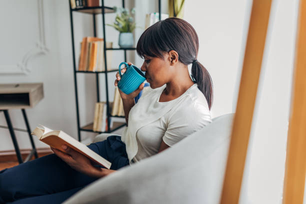 istock Woman reading a book 1419859003