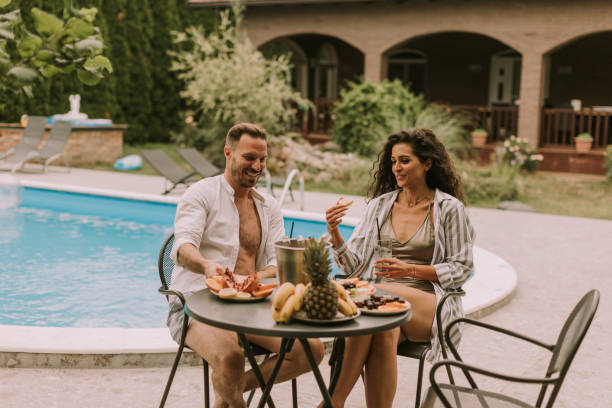 istock Young couple sitting in the backyard 1419859652