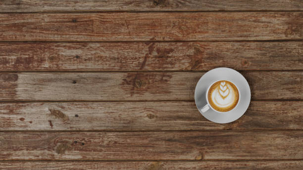istock Top view coffee cup on wooden table background 1419860505