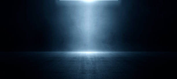 istock The dark stage shows, blue background, an empty dark scene, neon light, and spotlights The asphalt floor and studio room with smoke float up the interior texture for display products. illustration 1419861119