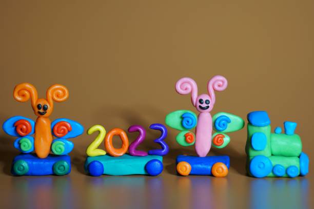 istock A toy train with fabulous figures and the number 2023. 1419863480