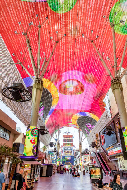 hustle and bustle of crowds during the day on the famous fremont street in the heart of downtown las vegas with its casinos, neon lights and street entertainment - downtown las vegas fremont street experience nevada las vegas metropolitan area imagens e fotografias de stock