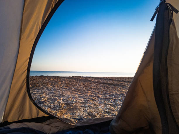 istock tent camping by sea 1419865265