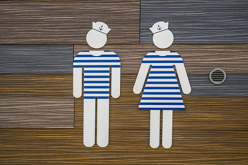 tolilet sign showing silhouettes of a man and a woman dressed in sailor suits, Denmark, August 8, 2022