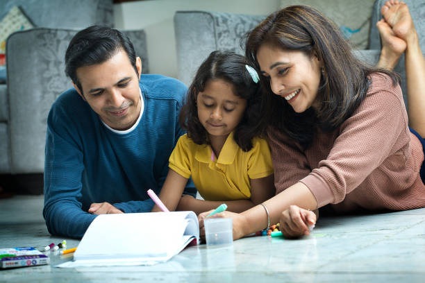 istock Woman Lying On Floor And Teaching Her Daughter 1419870438