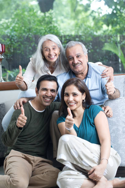 istock Indian Family Giving Thumbs Up Gesture 1419870558
