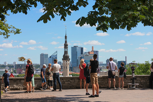 Tourists at an overlook in the city of Tallinn, Estonia.