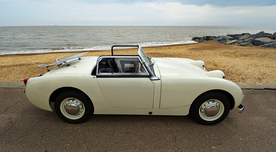 Felixstowe, Suffolk, England - May 01, 2022:  Classic White Austin Healey Sprite Motor Car Parked on Seafront Promenade.