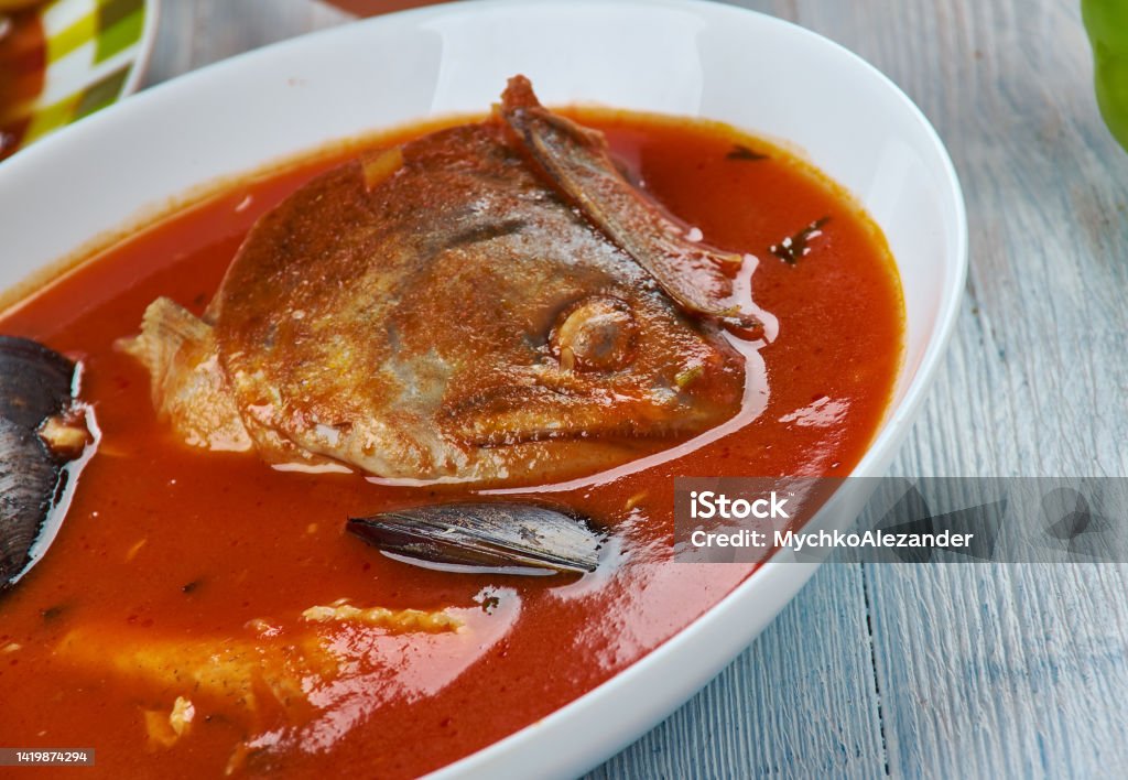 Balkan Brudet Brudet, fish stew made in Croatian regions of Dalmatia, Kvarner and Istria, as well as along the coast of Montenegro, Balkan cuisine cuisine, Traditional assorted dishes, Top view. Cajun Field Stock Photo