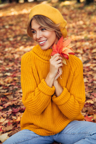 istock Beautiful woman holding a leaf 1419875729