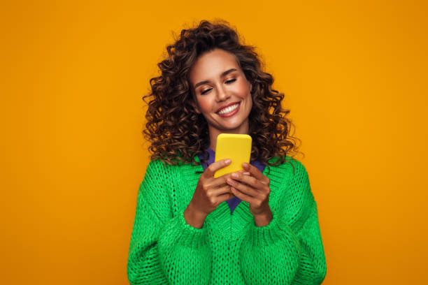 istock Beautiful emotional woman using smartphone 1419876259