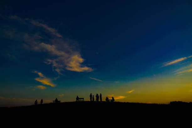 Sunset hill and people silhouette. Shooting Location: Mitaka City, Tokyo