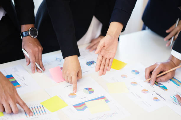 istock Teamwork concept,man and woman operate in the office with collaborative cooperation or participation,Project managers meet a business crew working with new startup. Analyze business plans 1419882332