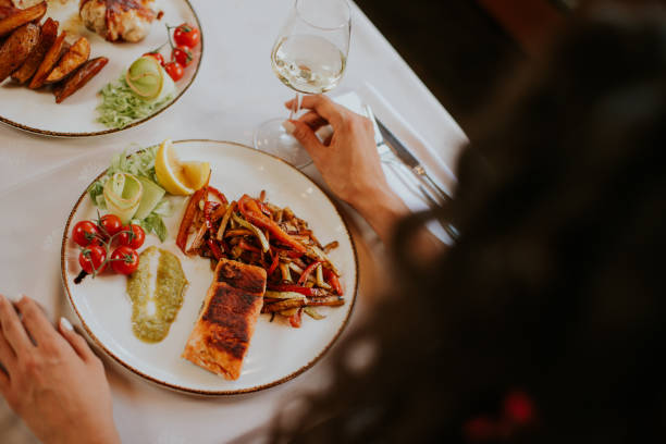 istock Young couple having lunch with white wine in the restaurant 1419887785