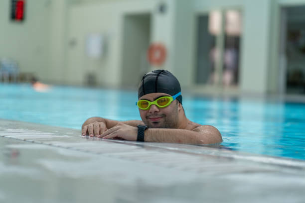 istock Boy with down syndrome in the swimming pool 1419892796