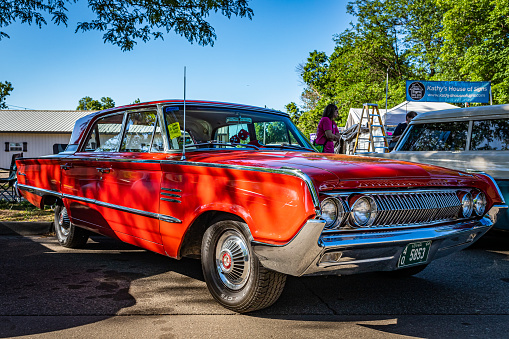Falcon Heights, MN - June 17, 2022: Low perspective front corner view of a 1964 Mercury Montclair Breezeway Sedan at a local car show.