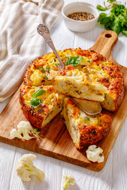 istock Cauliflower Cake with cheese, basil, top view 1419895606