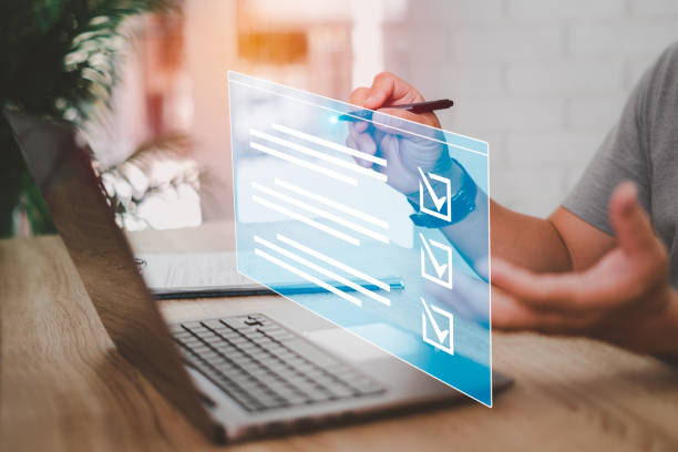 istock Businessman smart checklist and signs electronic on digital documents  concept, Businessman use a pen signs on virtual screen documents with laptop on table 1419899419