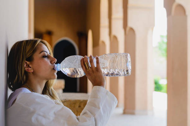 woman drinking water stock photo