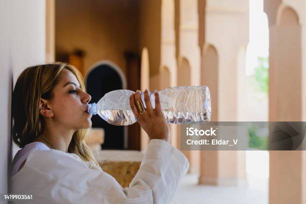 Woman Drinking Water Stock Photo - Download Image Now - Active Lifestyle, Adult, Adults Only