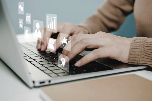 istock Financial. people hand using laptop computer with virtual graphic icon diagram on desk at home office, digital marketing, work from home, business finance, internet network technology concept 1419904089