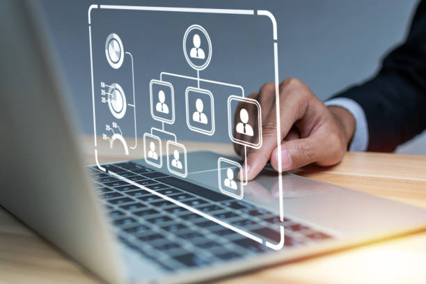 istock businessman hand touching on laptop computer with digital business organization chart icon diagram in meeting room office, human resource, job interview, digital marketing, internet network concept 1419904112