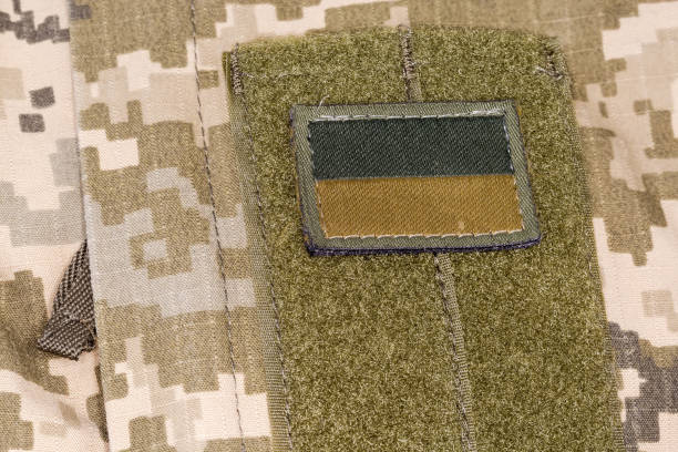 istock Ukrainian flag patch in camouflage color scheme on camouflage uniform 1419905738