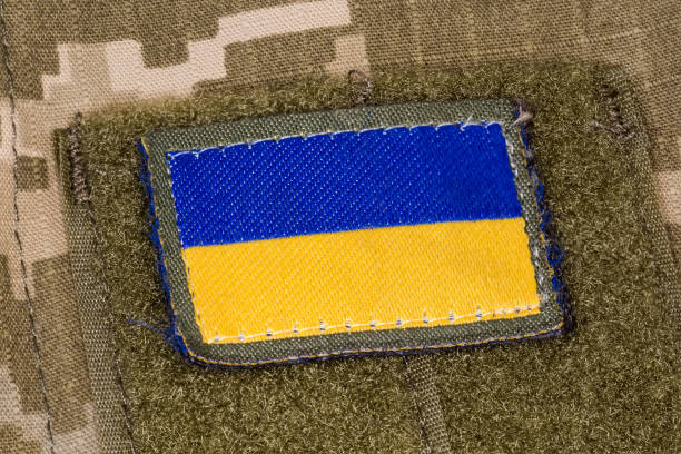 istock Ukrainian flag patch with textile fastener on a camouflage uniform 1419906155