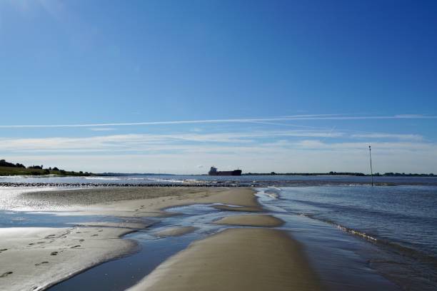 Low tide at Elbe River on which container ships to and from Hamburg can be observed