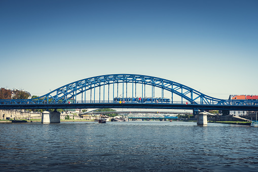 Marshal Pisudski Bridge. Blue steel construction on the Vistula river. Cracow, Poland