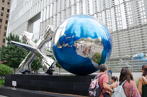 Monument at entrance of One World Observatory in New York during summer day