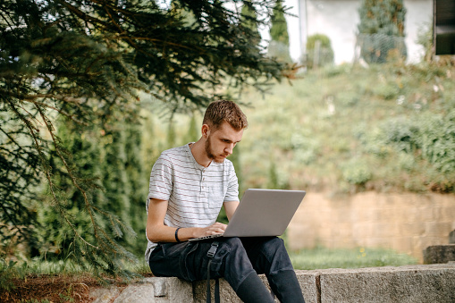 Single person on laptop in nature