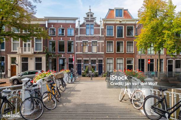Canal Houses On The Westhaven And A White Painted Bridge Over The Canal In The Center Of The Historic City Of Gouda Stock Photo - Download Image Now