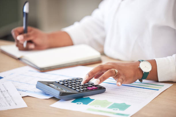 istock Finance, accounts and data analyst planning for tax return and calculating new financial strategy. Professional accountant working with bank reports and invoice charts to calculate income money 1419924033