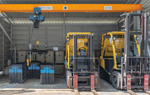 Forklifts parked to charge batteries